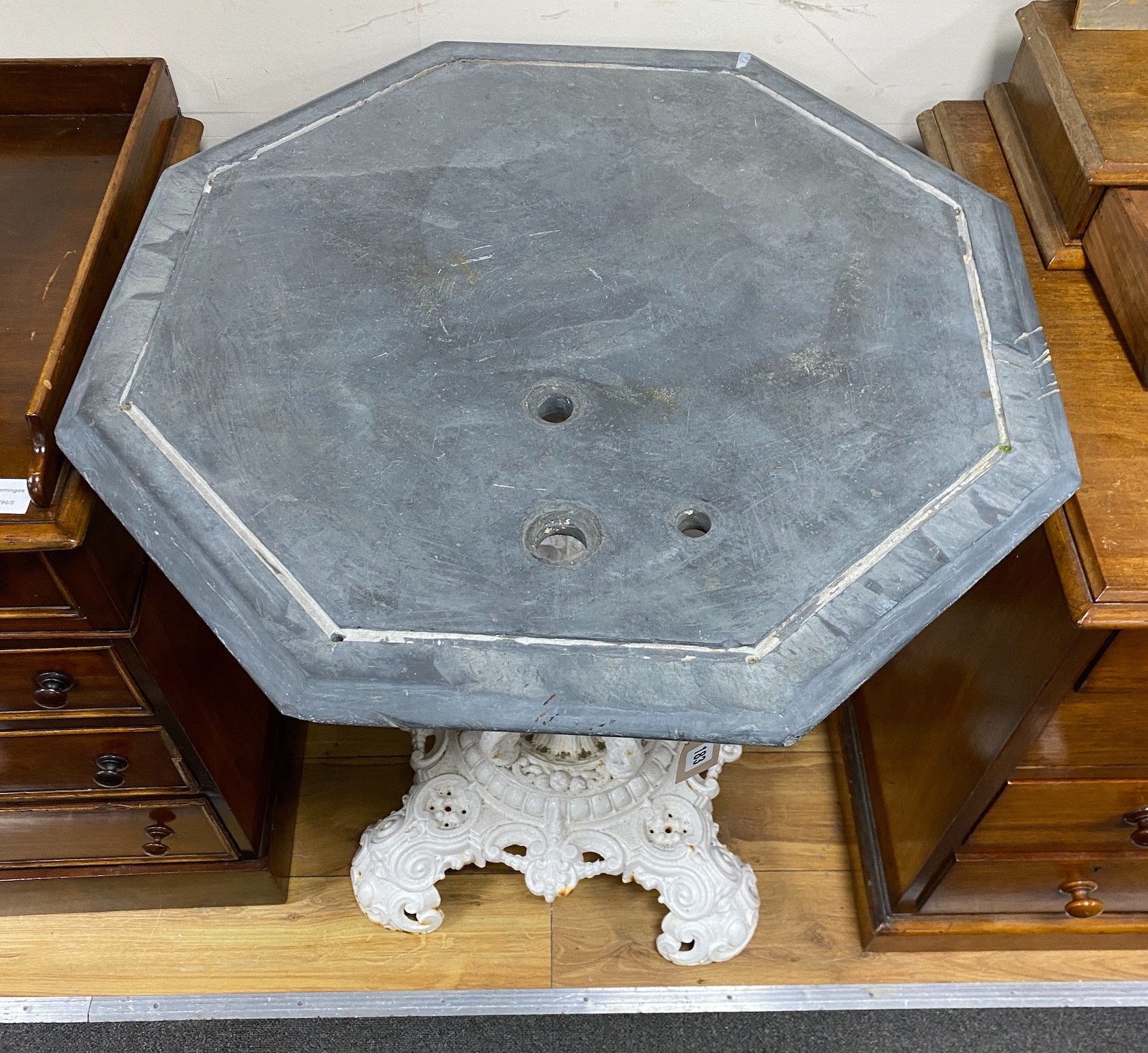 A Victorian octagonal cast iron slate top table, width 70cm, height 81cm